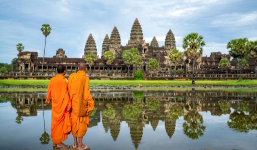 Asian  monk stand and look to Angkor wat in siem reap, Cambodie, this image can use for travel and landmaek in Asia