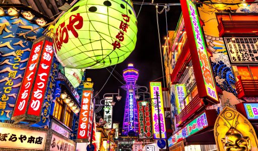 OSAKA - NOVEMBER 24: Tsutenkaku Tower in Shinsekai (new world) district at night on November 24, 2014, in Osaka. It is a tower and well-known landmark of Osaka, Japan and advertises Hitachi, located in the Shinsekai district of Naniwa-ku, Osaka.